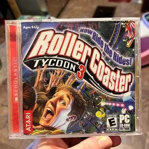 RollerCoaster Tycoon 3 (PC 2004) game roller coaster book 742725256552